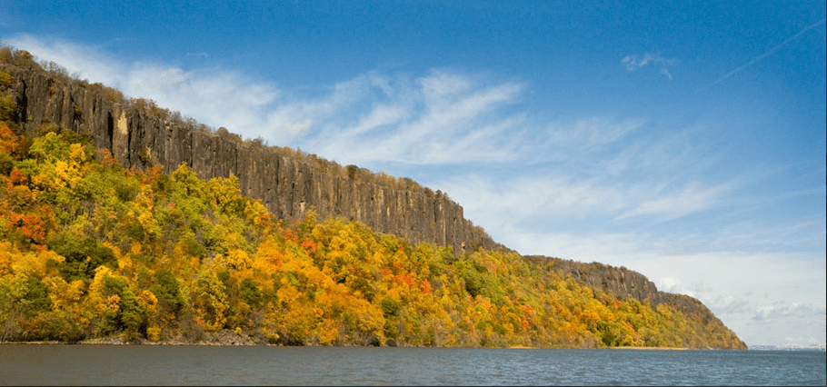 Hudson River and the Palisade Cliffs during a fall foliage boat tour from NYC