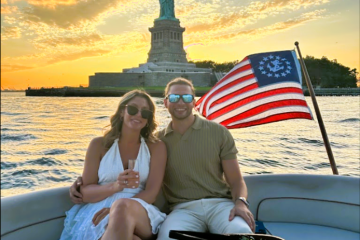 man and a woman during a sunset cruise NY after a surprise marriage proposal on a boat