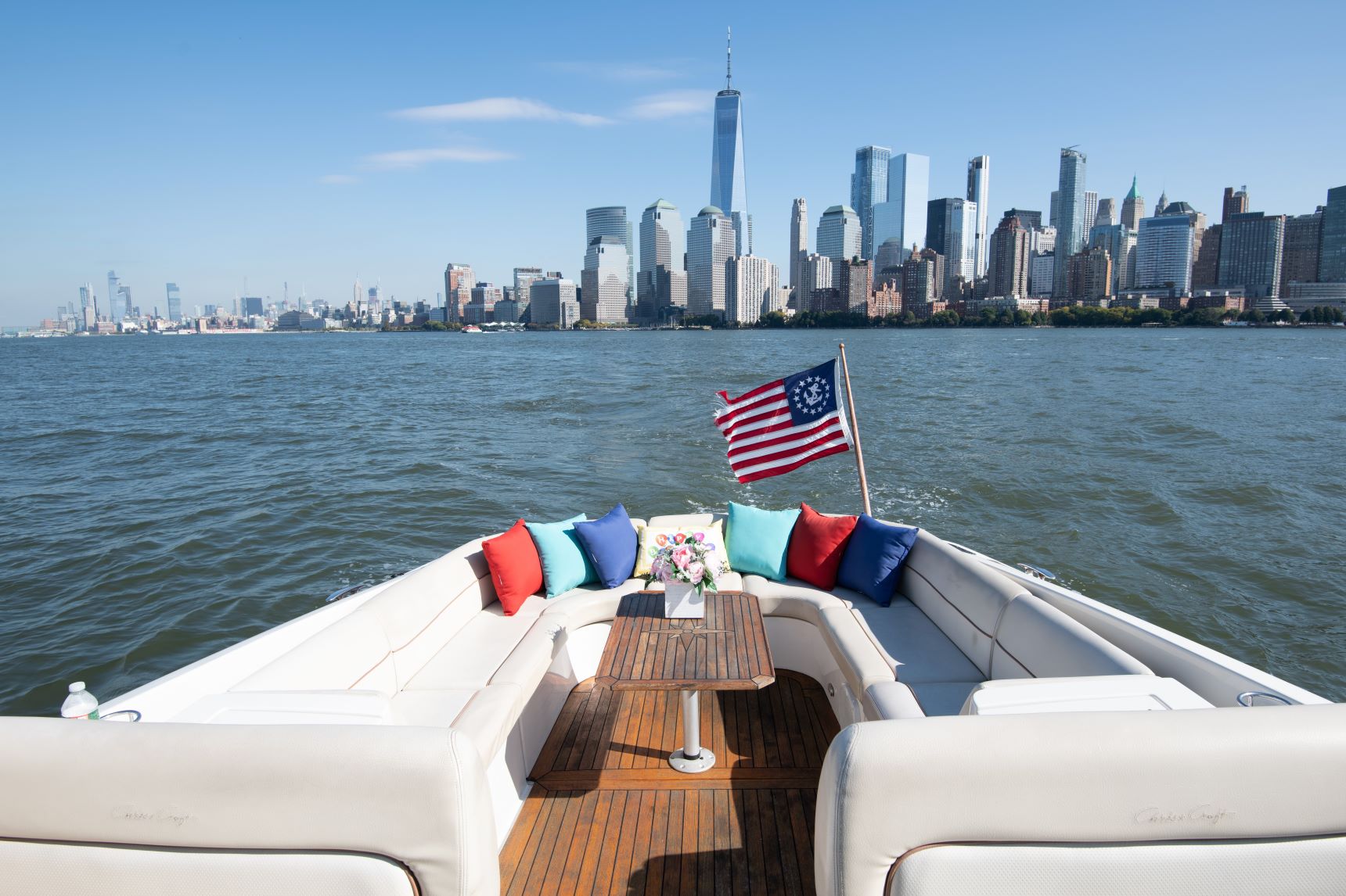 new york yacht rental with colorful pillows and the city skyline