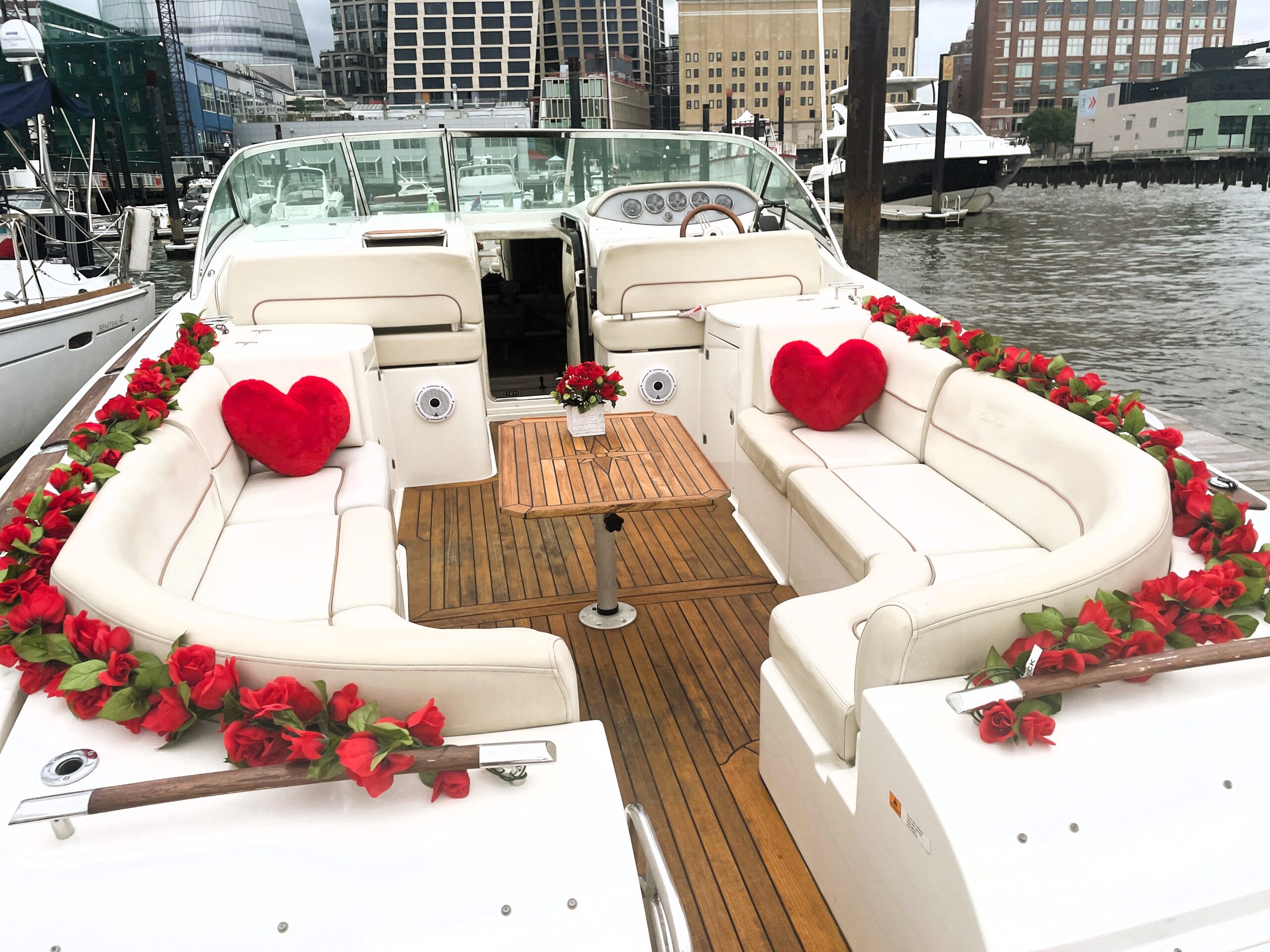 beautiful yacht for a proposal in Manhattan Chelsea Piers with red rose bouquet