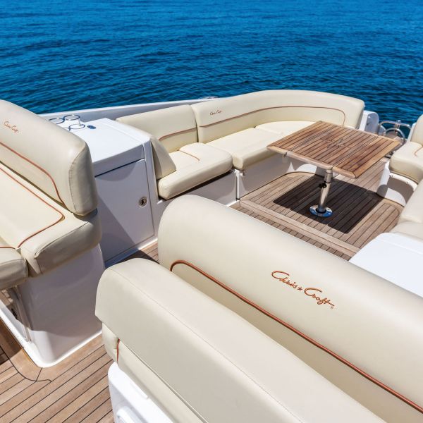 small boat in NYC for rent with outdoor deck and white cushions