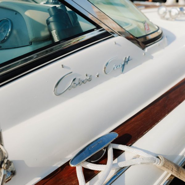 close up of boat rentals with the dock ropes tied to cleats in a New York marina