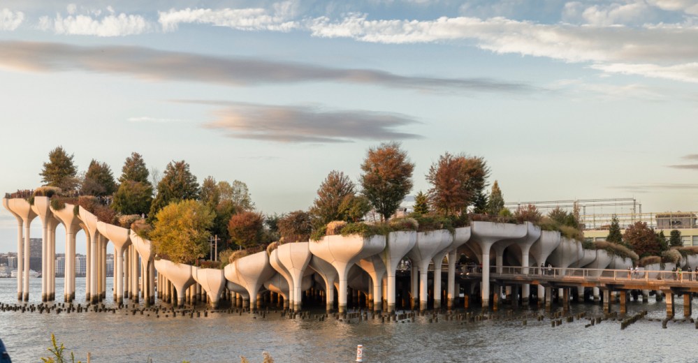 Little Island on elevated platforms over water, during daytime, near the Chelsea Piers Marina and Dream Boat NY.