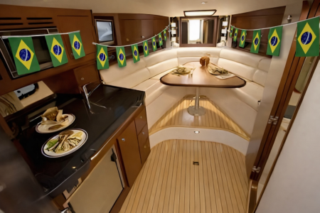 Boat interior with Brazilian flag bunting and meal on the table for the World Cup in NYC.